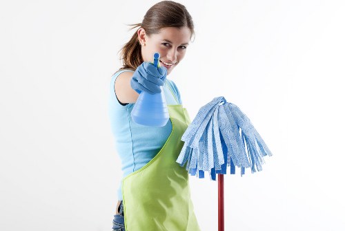 Cleaning technician preparing carpet cleaning equipment before a service appointment