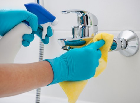 Kitchen surfaces being cleaned during domestic cleaning in Chelsea